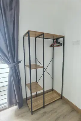 a black and wooden shelf in a room with a window at Cosy 2-Storey Holiday Home Vines 2 @Pasar Malam -2 in Tanah Rata