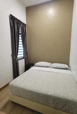 a bed in a room with a window at Cosy 2-Storey Holiday Home Vines 2 @Pasar Malam -2 in Tanah Rata