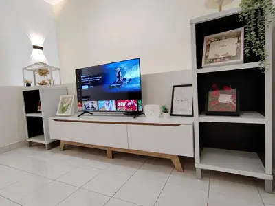 a computer monitor on a desk in a room at Sunway Tambun Salesman Stay 5 Bedroom 10pax by IWH in Ipoh