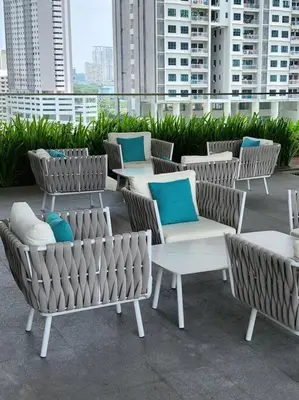a group of chairs and tables on a rooftop at Modern Luxe Island Suites #3BR in Jelutong