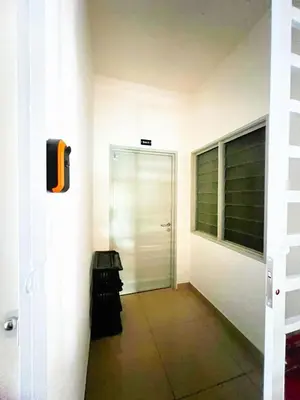 a hallway with a door in a building at PMRTJ BY D Atas Bukit Antarium in Tanah Rata