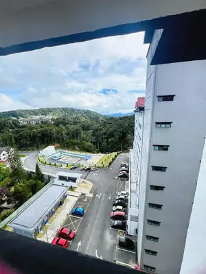 a view of a parking lot from a building at PMRTJ BY D Atas Bukit Antarium in Tanah Rata