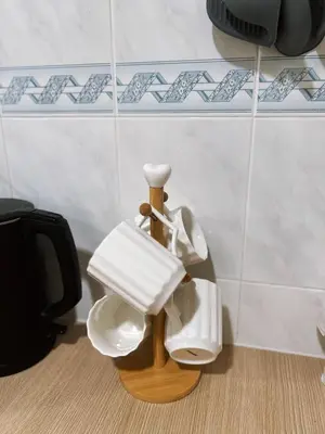 a bathroom with two white urinals on the floor at Jo Jo Homestay @ Pangkor Coral Bay Resort in Pasir Bogak
