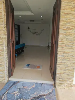 a hallway with a door open to a room at Padang Serai Room Stay Share Bathroom in Padang Serai