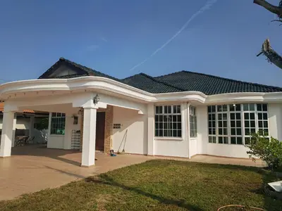 a large white house with a roof at Padang Serai Roomstay Family Suite Share Bathroom804 in Padang Serai