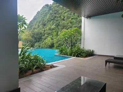 a view of a swimming pool with a mountain at Doma House Onsen at Sunway Onsen, Tambun in Ipoh