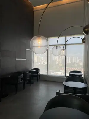 a restaurant with tables and chairs and a large window at 2 Carpark 3R2B 10 Pax City View Condominium 23A in Jelutong