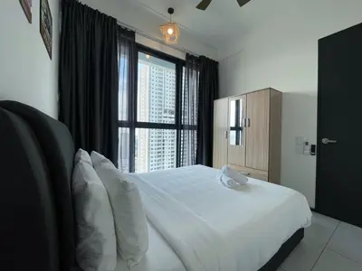 a bedroom with a white bed with a large window at 2 Carpark 3R2B 10 Pax City View Condominium 23A in Jelutong