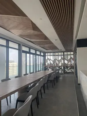 a long table and chairs in a room with windows at 2 Carpark 3R2B 10 Pax City View Condominium 23A in Jelutong