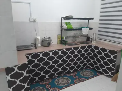 a black and white rug on the floor in a room at DIAMOND HOMESTAY in Kuala Kangsar