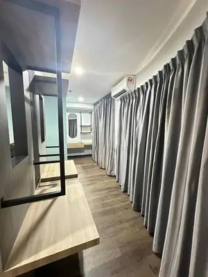 a row of grey curtains in a room at EpochHotel in Taiping