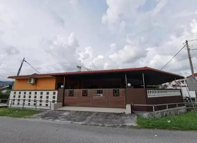 a small house with a red and white fence at IPOH Be-Shine TAMAN WANG 13-14pax Homestay with 6Bedrooms, 6Bathroom, 1Living, 1Dining, 1Kitchen with 3Parkings in Ipoh