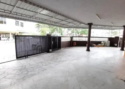 an empty room with a large patio with a fence at IPOH Be-Shine TAMAN WANG 13-14pax Homestay with 6Bedrooms, 6Bathroom, 1Living, 1Dining, 1Kitchen with 3Parkings in Ipoh