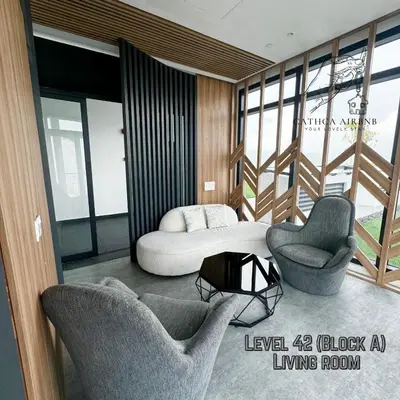 a living room with two chairs and a bed at Urban Suites Studio #SelfCheck-In #PrivateSpace in Jelutong