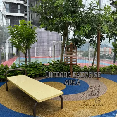 an outdoor exercise area with a bench and a sign at Urban Suites Studio #SelfCheck-In #PrivateSpace in Jelutong