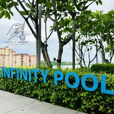 a sign for the infinity pool at the entrance to a resort at Urban Suites Studio #SelfCheck-In #PrivateSpace in Jelutong