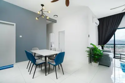a dining room with a table and blue chairs at Ben Cozy Executive Suite 3BR The Horizon Ipoh in Ipoh
