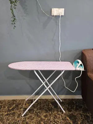 a pink ping pong table next to a wall at The Blue Guest House, WiFi, Free Parking, Aulong in Taiping