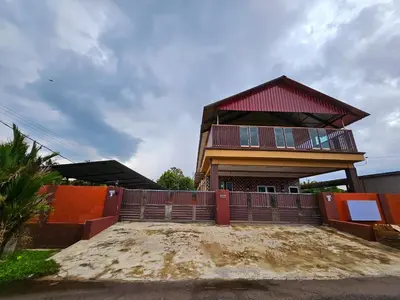 a house with a red roof and a fence at The Blue Guest House, WiFi, Free Parking, Aulong in Taiping
