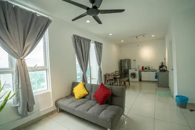 a living room with a couch and a ceiling fan at Georgetown Seaview MansionOne @Penang in George Town