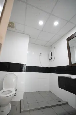 a bathroom with a toilet and a sink at Georgetown Seaview MansionOne @Penang in George Town