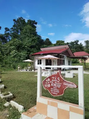 a sign on a fence in front of a house at Z&S Gerik Hillview Homestay in Gerik