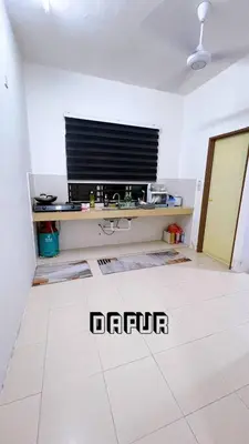a living room with a tv and a white floor at HomeSTAY D'Manjung Lumut in Lumut