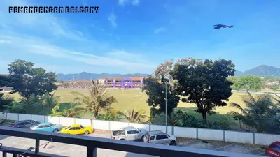 a group of cars parked in a parking lot at HomeSTAY D'Manjung Lumut in Lumut