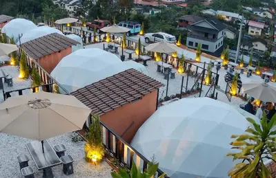an overhead view of a resort with umbrellas and tables at Gold Crest Cameron Highlands in Tanah Rata