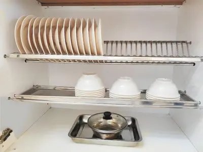 a kitchen shelf with plates and a sink in a refrigerator at HT Homestay BigSemi-D BBQwedding in town in Jelutong