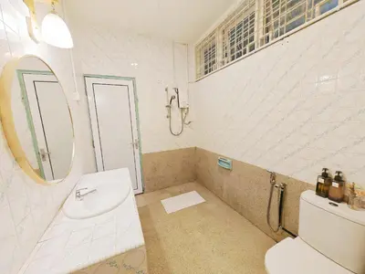 a bathroom with a sink and a toilet and a mirror at HT Homestay BigSemi-D BBQwedding in town in Jelutong