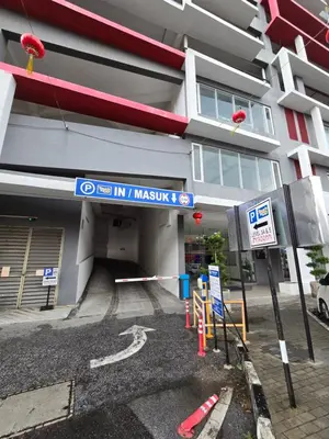 a building with a sign in front of it at The Octagon Ipoh City Centre Leisure Suite in Ipoh