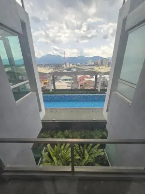 a view of a swimming pool from a building at The Octagon Ipoh City Centre Leisure Suite in Ipoh