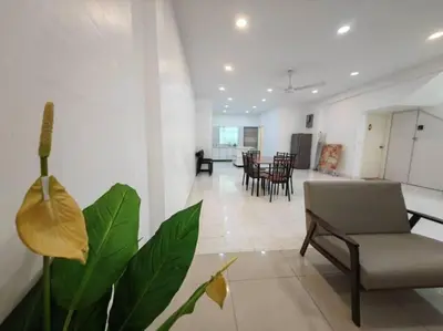 a living room with a chair and a table at 90 Home4Stay 2storeySemi-D gurney&beach Shopping local food in Tanjung Bungah