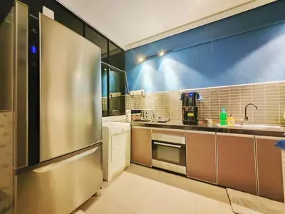 a large kitchen with a stainless steel refrigerator at 12 George town 6room terrace gurney heritage adventist hospital restaurant shopping mall in George Town