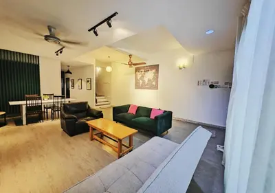 a living room with a couch and a table at 12 George town 6room terrace gurney heritage adventist hospital restaurant shopping mall in George Town