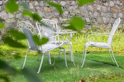 a group of chairs and tables in a yard at 35 Home4Stay Tanjong Bungalow Wedding BBQ Near Beach restaurant in Tanjung Bungah