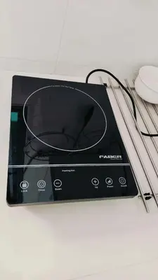 a electronic device with a mouse on a table at Nyaman Sweet Home in Balik Pulau