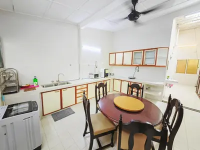 a kitchen with a table and chairs in a room at 7 Home4Stay Peaceful GurneyTerrace 4BR15pax Shops & Eateries in George Town