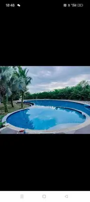 a picture of a large blue swimming pool at Idea Homestay 1 in Chemor