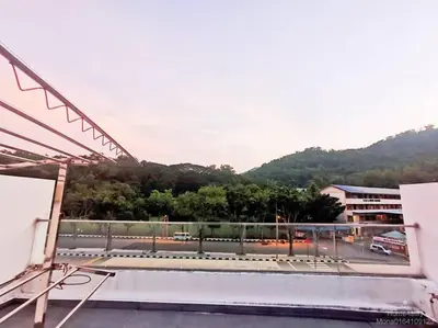 a building with a view of a parking lot at 162 Home4Stay Deluxe Big 3story 6Rooms 20pax Wedding USM Arena Bridge in Gelugor