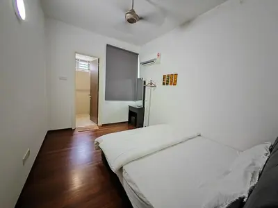 a bedroom with a white bed in a room at 162 Home4Stay Deluxe Big 3story 6Rooms 20pax Wedding USM Arena Bridge in Gelugor