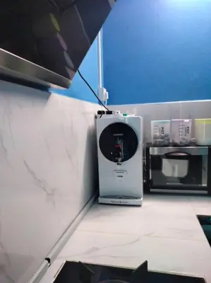 a kitchen with a microwave oven and a microwave at MyLittle Homestay in Tanjung Malim