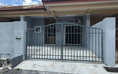 a gate in front of a house at MyLittle Homestay in Tanjung Malim