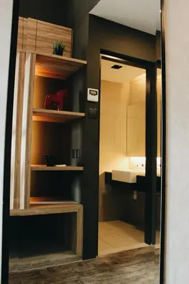 a room with a bathroom with a sink and a mirror at U Hotel Penang in Bayan Lepas