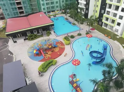 an overhead view of a water park with two pools at 3R Guest House Manhattan Condominium in Ipoh