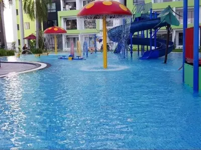 a water park with a slide in a pool at 3R Guest House Manhattan Condominium in Ipoh