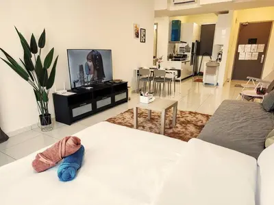 a living room with a couch and a tv at SkyPool 2Br 8pax Premium Suites Beacon Georgetown Penang in George Town