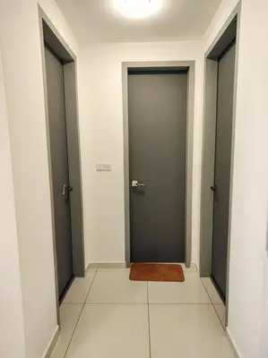 a hallway with two doors and a rug on the floor at SkyPool 2Br 8pax Premium Suites Beacon Georgetown Penang in George Town