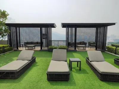 a room with two beds and a table on grass at SkyPool 2Br 8pax Premium Suites Beacon Georgetown Penang in George Town